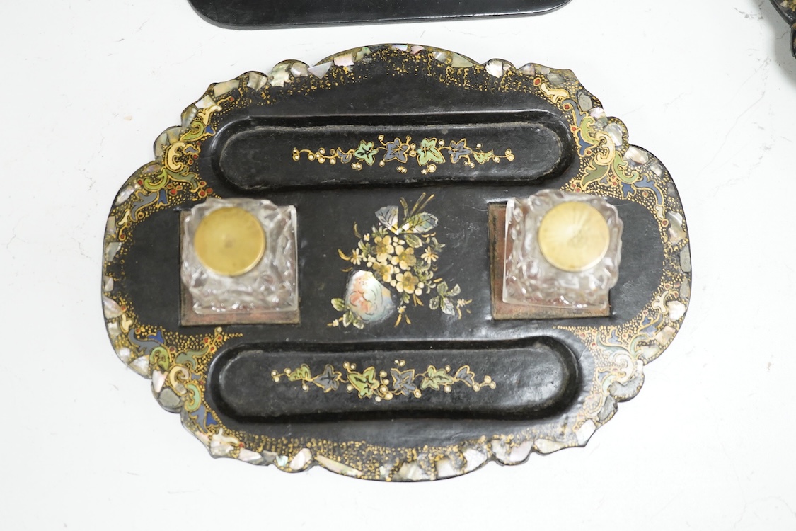 A collection of Victorian papier maché to include an inkstand, a pair of Victorian mirrored wall brackets and a swing handled dish, largest 30cm high